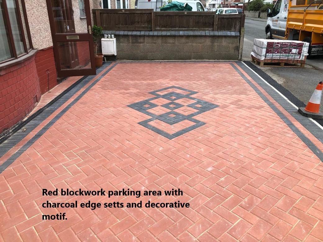 Block paved driveway with decorative brick pattern